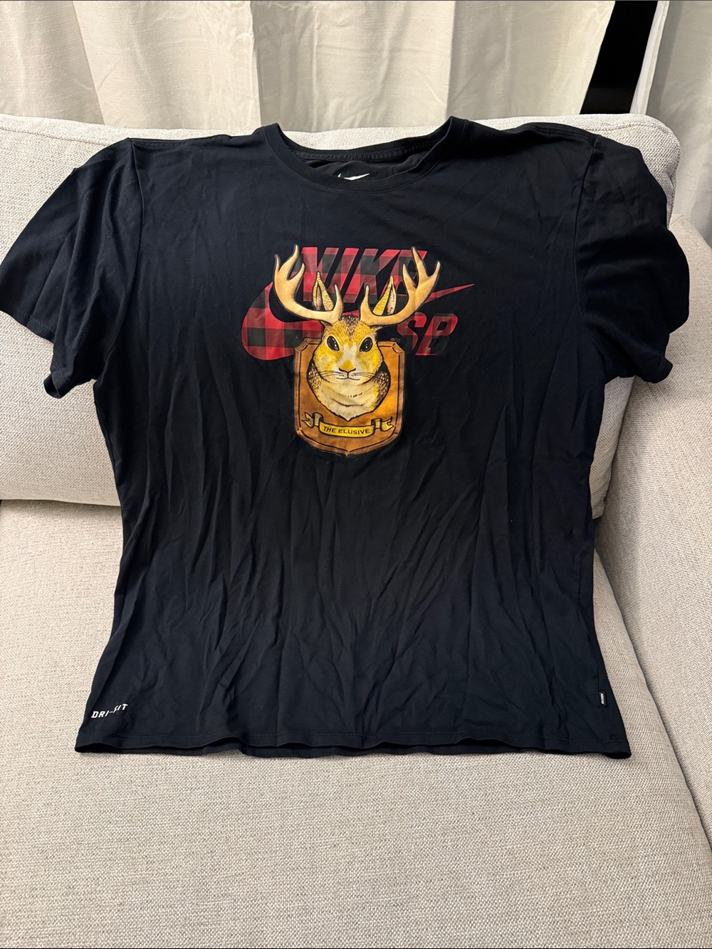 Nike Black Tee with Yellow Deer Crest and Red Plaid Logo
